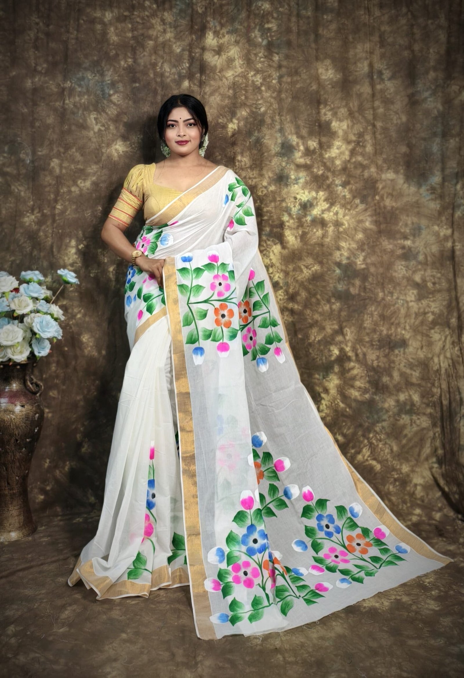White Kerala Cotton Saree with Hand-Painted Floral Art & Golden Border