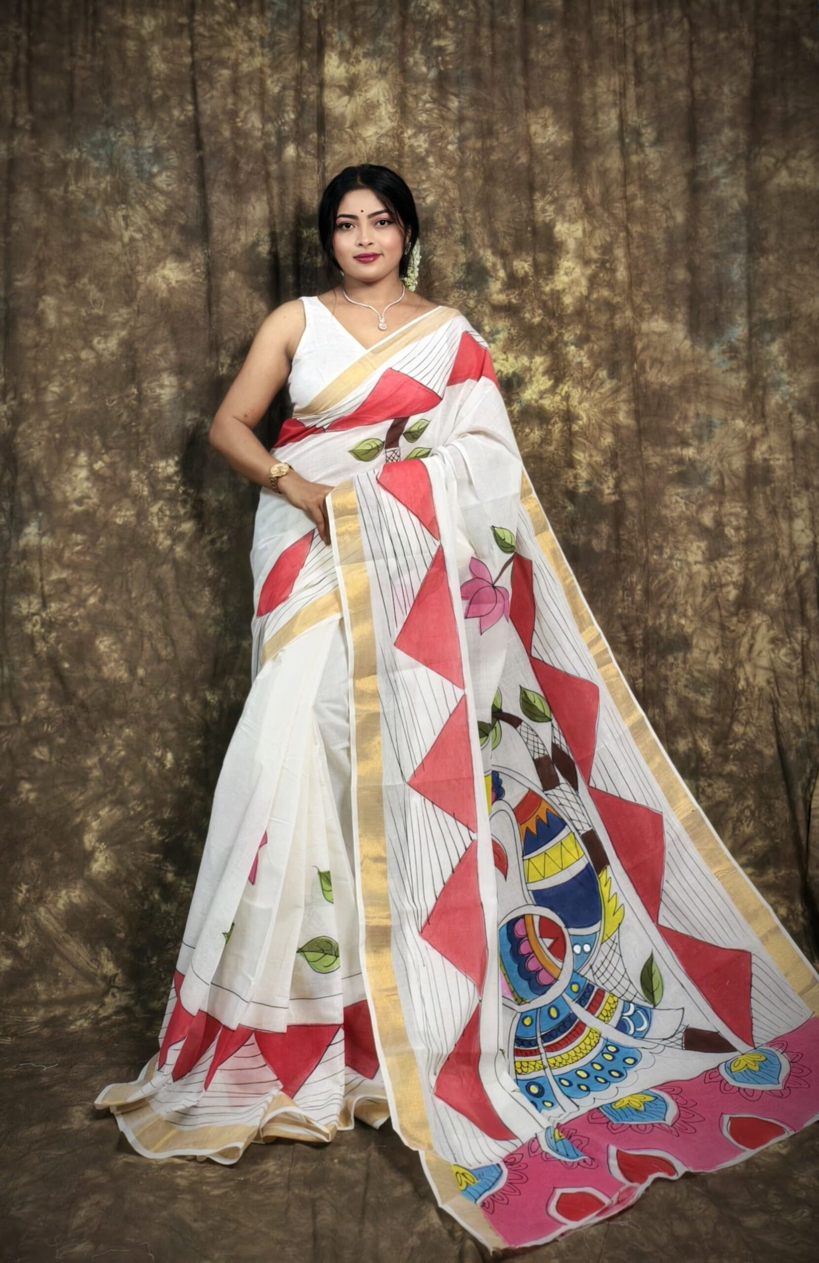 Hand-Painted White Saree with Multicolor Motifs & Golden Border